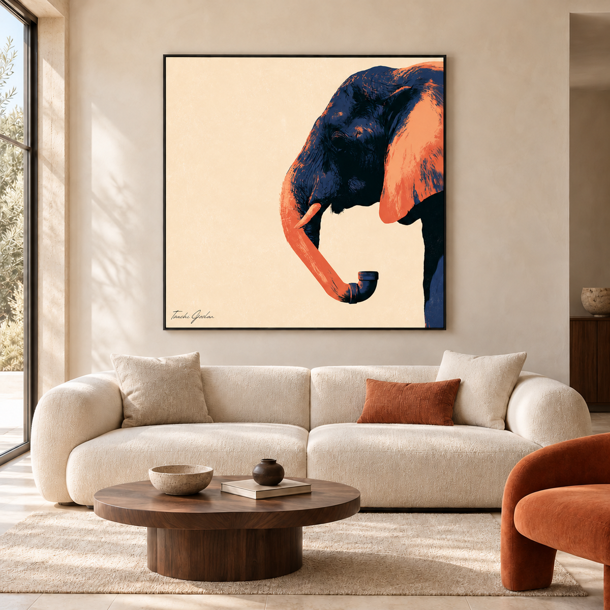 Trunk Line by Tzachi Gozlan – Elephant in navy and burnt orange, framed above a beige sofa in a living room